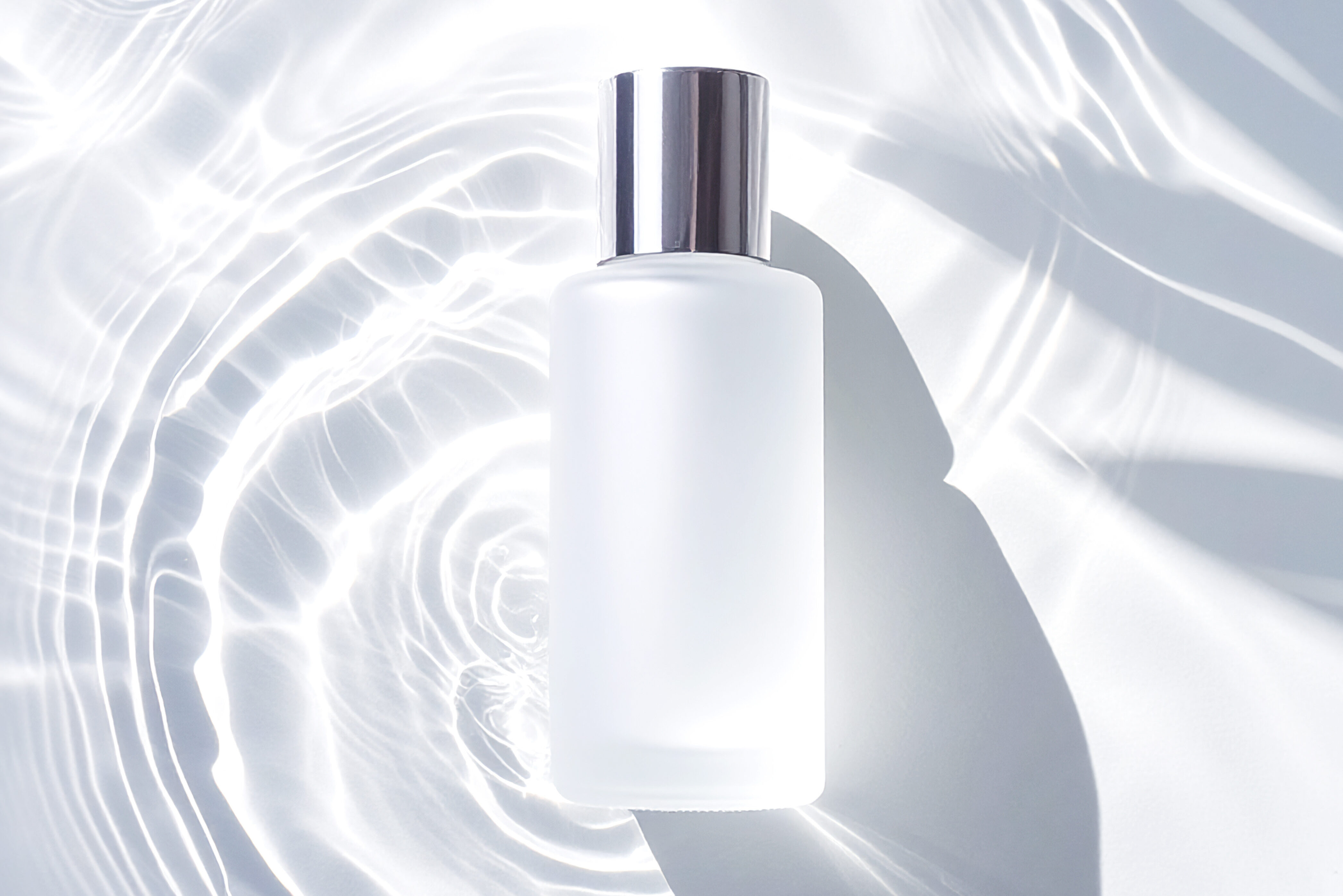 Cosmetic Bottle Mockup with Water Reflection